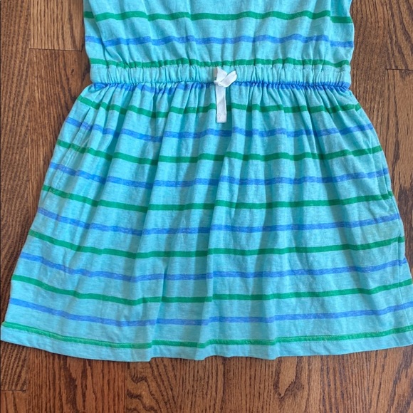 New with tag, blue and green striped Primary dress size 6-7. Ships quickly. - Picture 4 of 7